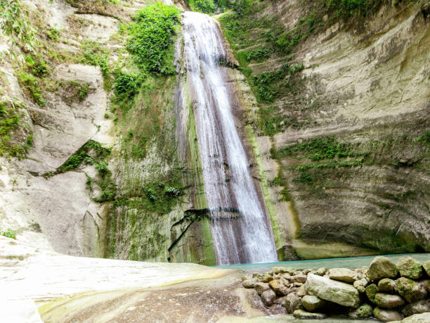 istock Tropical waterfall at mountain gorge in Dao Falls in Cebu Island 1177684491