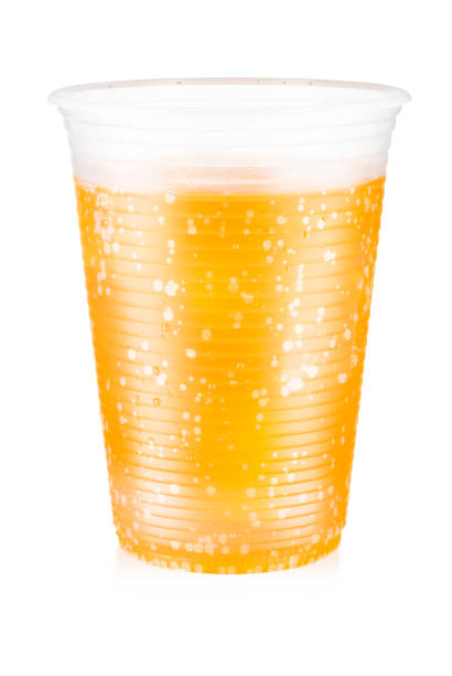 istock Orange carbonated drink with ice in a plastic cup isolated on white background 1177684759