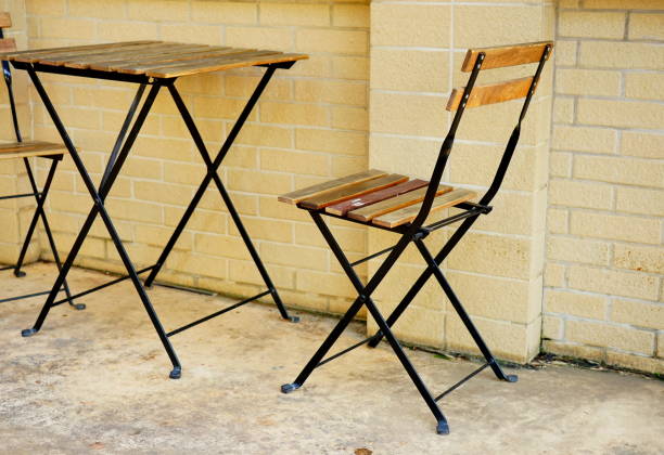 istock Table and two chairs near the wall 1177685272