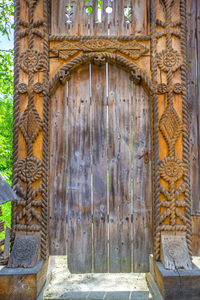 Traditional wood sculpture, decorated gate in Maramures, Romania