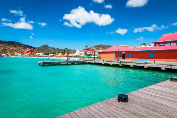 Colorful image of Philipsburg, St Maarten Sint Maarten, Saint Martin, Caribbean. Tender platform in the city centre of Philipsburg. Popular cruise destination. Blue sky and white clouds on a beautiful summer day.