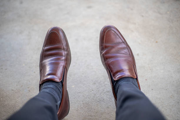 istock Standing leg with brown leather feet classic 1177696477