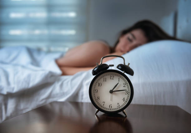istock Woman is sleeping in bed at night 1177699817