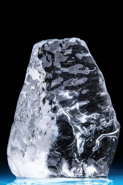 istock Piece of ice block on the black background 1177705584