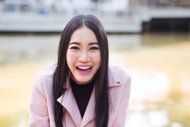 istock Cheerful happy laughing young thai woman 1177707493
