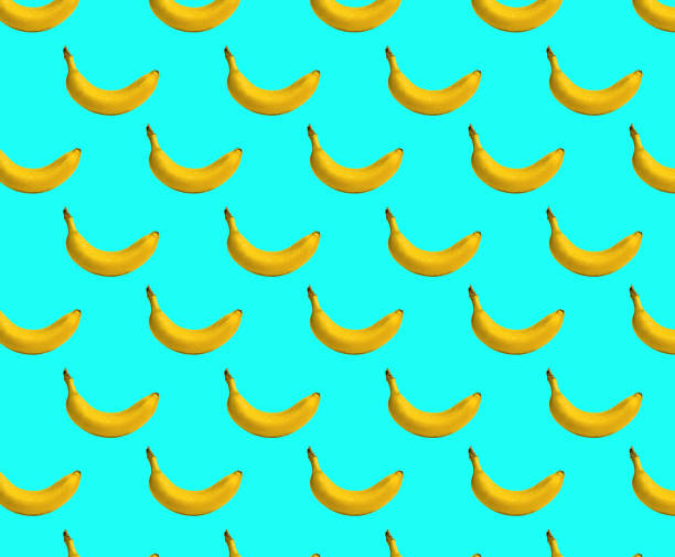 istock Pattern bananas. Fresh ripe wet bananas fruit, water drops, aqua background 1177709062