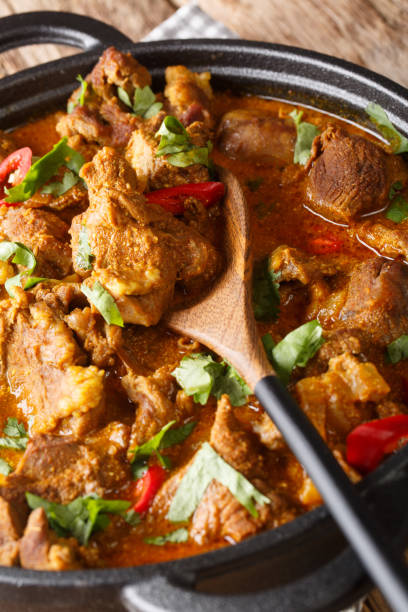 istock Lamb rogan josh close-up in a pan. vertical 1177710728