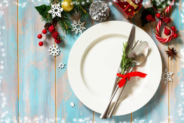 istock Christmas table setting. Festive plate and cutlery with decor on festive table. 1177710764