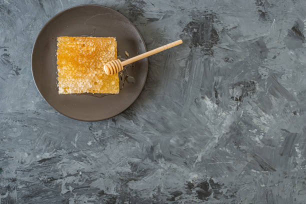 istock Honeycomb on black plate on black background 1177713603
