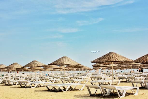 istock Sun umbrellas and deck chairs at the beaches 1177713746