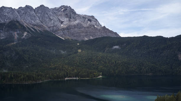 istock Cloudy german lake eibsee zugspitze 1177716312