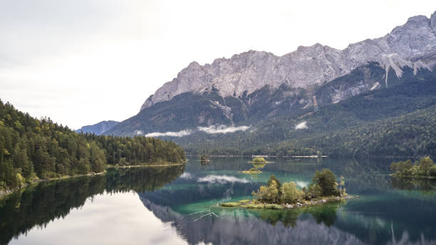 istock Cloudy german lake eibsee zugspitze 1177716390