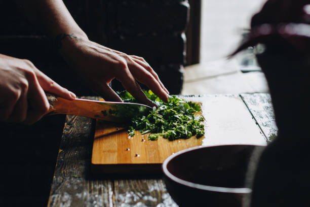 istock Woman hands chopping parsley 1177717467