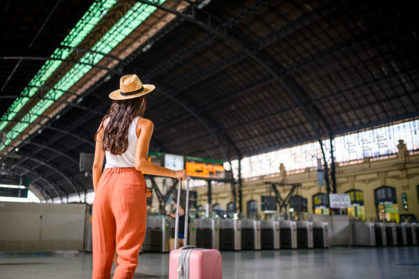 istock Young woman at the train station 1177719626