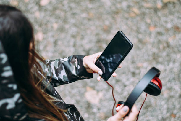 istock Young Female Listening Music Using Smartphone 1177719666
