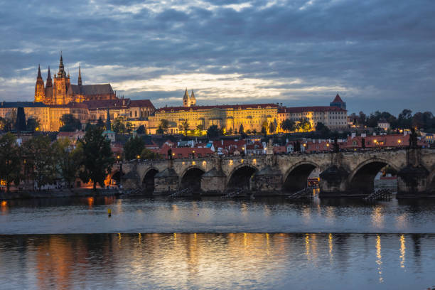 istock Prague castle over Charles Bridge during autumn sunset 1177720432