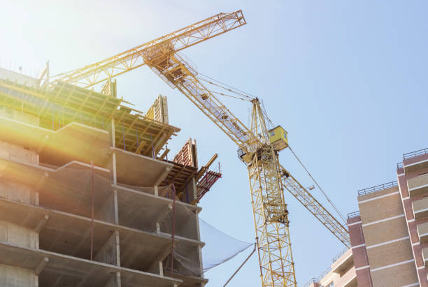 istock Construction site background. Hoisting cranes and new multi-storey buildings. 1177720514