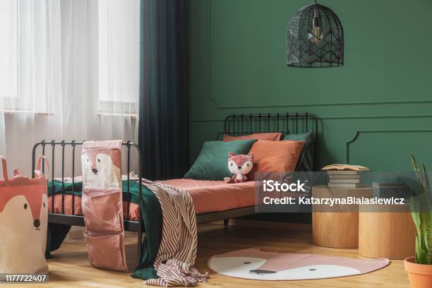 Black Fancy Chandelier In Fashionable Teenager Bedroom With Single Bed Stock Photo - Download Image Now