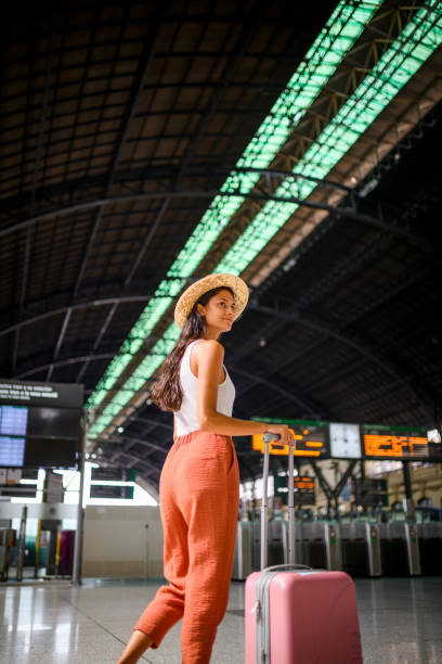 istock Young woman at train station 1177724424