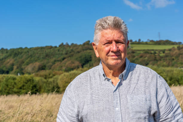 istock Senior Caucasian man on grassy bank 1177725500
