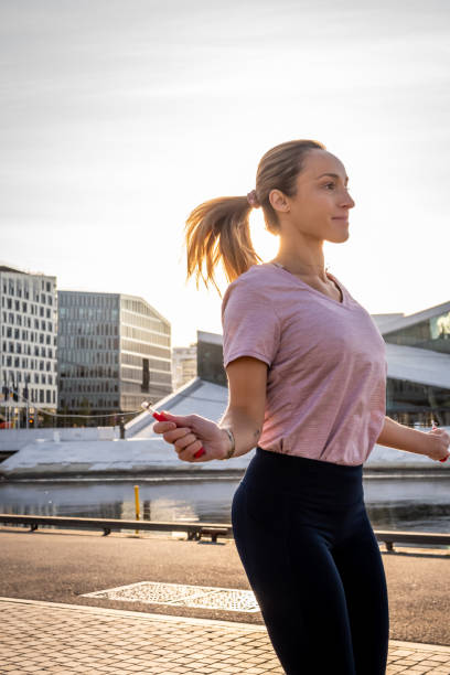istock Woman exercising in early morning. 1177726793