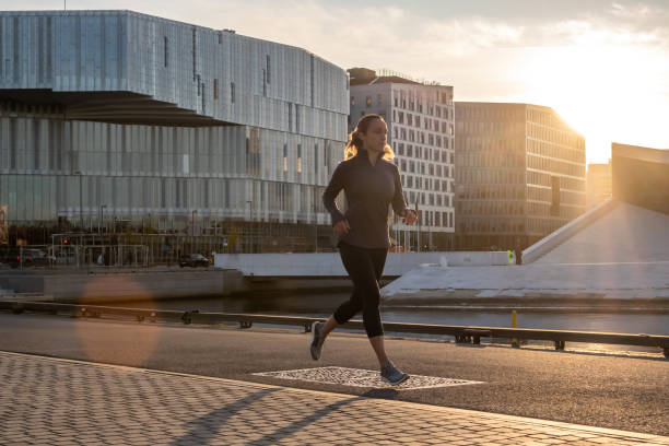 istock Woman exercising in early morning. 1177731250