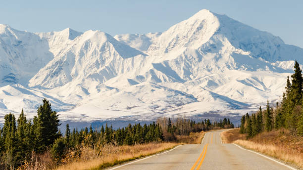 istock Remote Highway Road Toward Snowcapped Mountain 1177750954