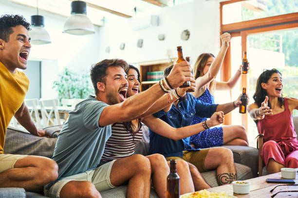 istock Excited fans shouting while watching match on TV 1177751944