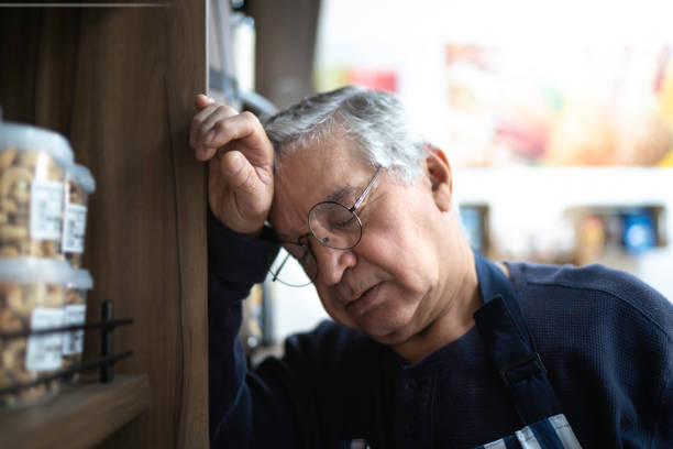 istock Senior seller taking a nap during work 1177751957