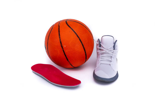 istock Modern mid-high white basketball shoes sneakers with orthotic inserts 1177752217