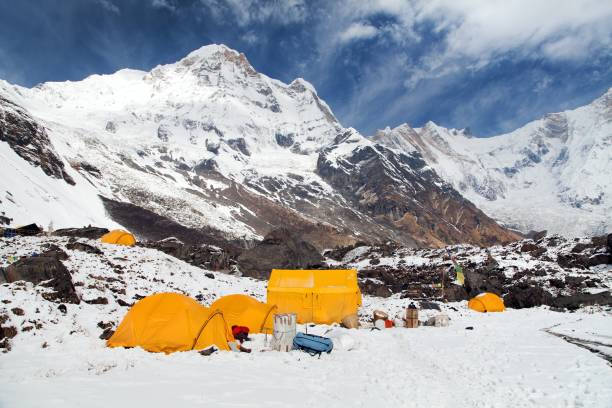 Mount Annapurna with tents from Annapurna base camp View of Mount Annapurna with tents from Annapurna base camp, Nepal himalayas mountains annapurna conservation area photos stock pictures, royalty-free photos & images