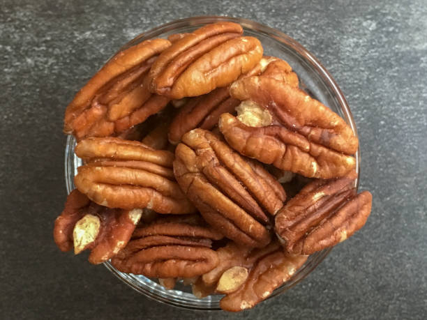 istock Glass Bowl Serving Size Snack of Pecan Nut Halves 1177758471