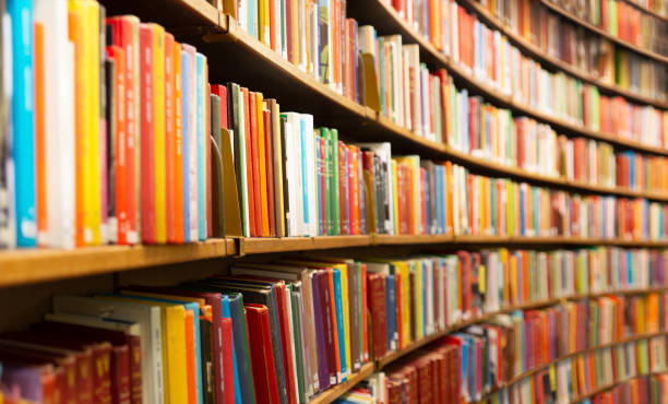 istock Library with many shelves and books 1177763147