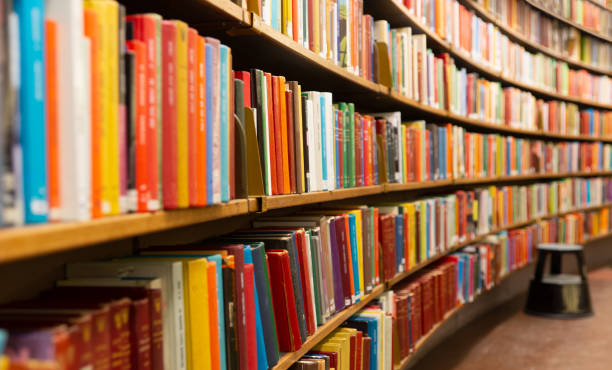 istock Library with many shelves and books 1177763741