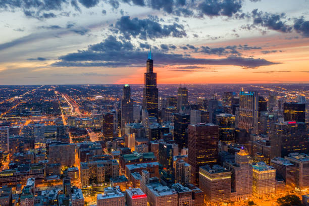 Aerial View of Chicago at Dusk 9/15/2019 - Chicago, USA - Aerial View of Downtown Chicago at Sunset aon center chicago photos stock pictures, royalty-free photos & images