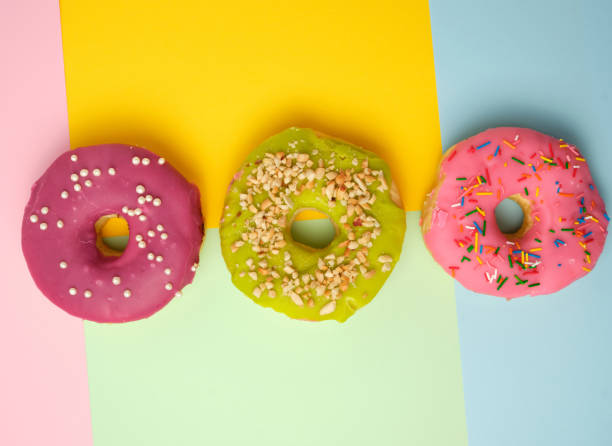 istock three round different sweet donuts with sprinkles 1177768431