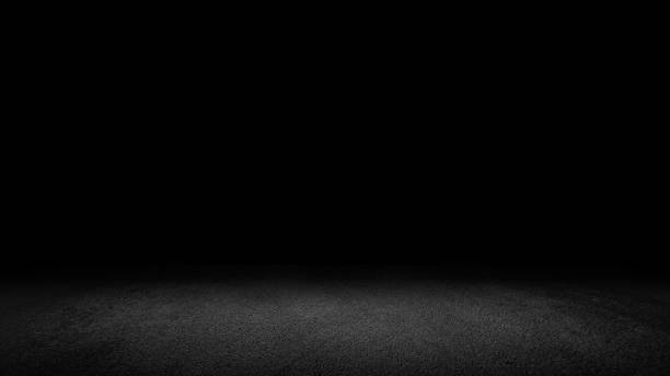 istock Cement floor background on studio room and spot light.Between darkness 1177770999
