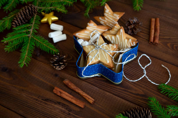 istock Christmas Cookies With Decorations On Wooden Table. 1177772114