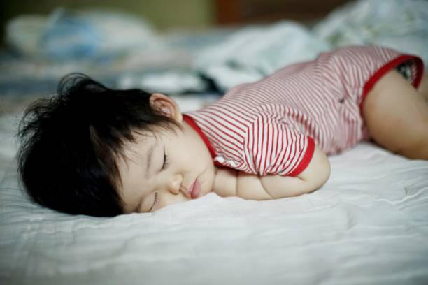 istock Cute little baby boy sleeping in bedroom 1177773987