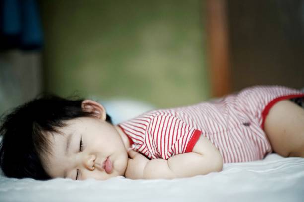 istock Cute little baby boy sleeping in bedroom 1177774001
