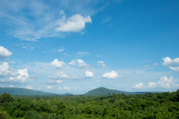 istock Mountains covered forest, trees and blue sky with clouds in Thailand 1177774119