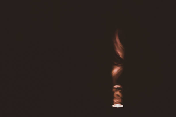 istock Colored smoke on black backdrop. abstract background with brown fog 1177776025