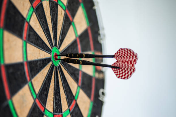 istock Success hitting target aim goal achievement concept background - three darts in bull's eye close up 1177776953