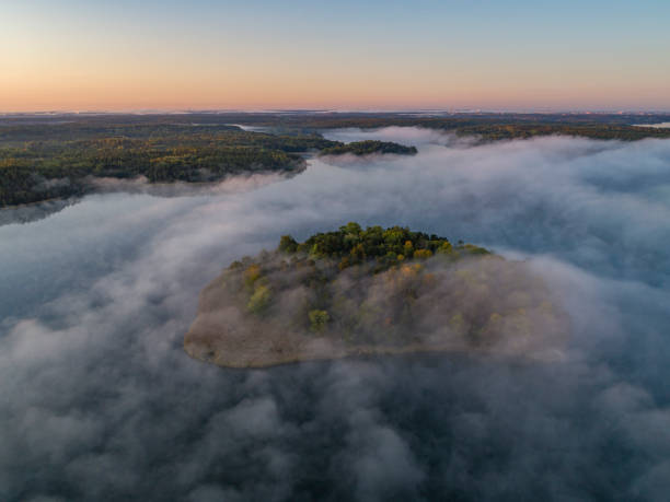 istock Aerial view over foggy lake 1177778923