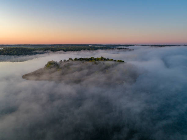 istock Aerial view over foggy lake 1177778940