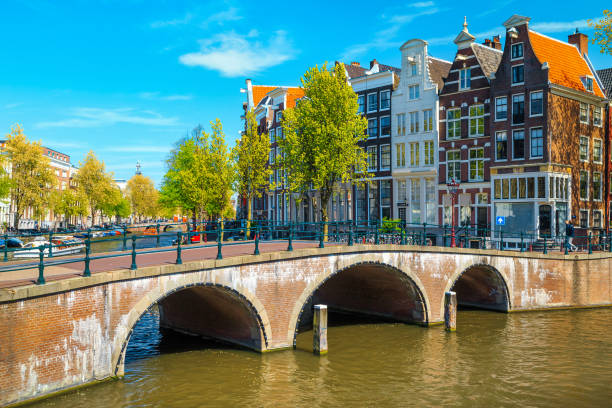 istock Waterfront with traditional dutch houses and old bridge, Amsterdam, Netherlands 1177789042
