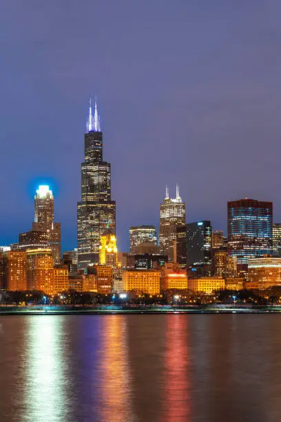 Photo of Chicago Cityscape river side along Lake Michigan at beautiful twilight time, Illinois, United States, Business Architecture and building with tourist concept