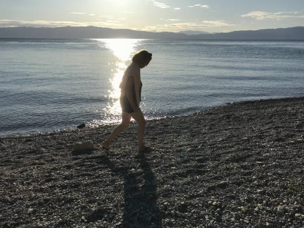 istock Woman at lake Ohrid 1177793687