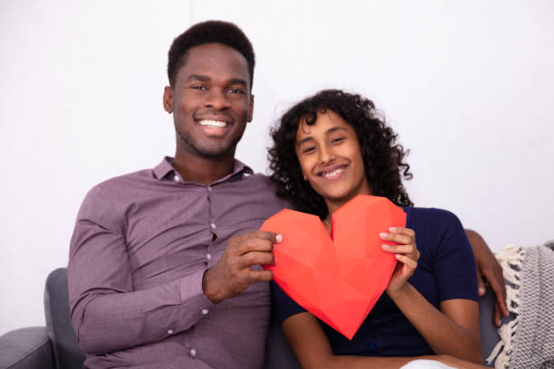 istock Romantic Couple Holding A Red Heart 1177794865