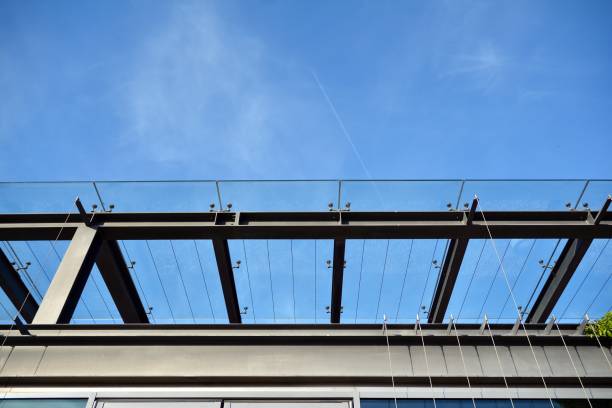 istock Abstract image of looking up at modern glass and concrete building. 1177797425